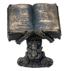 Skeleton holding Spell Book